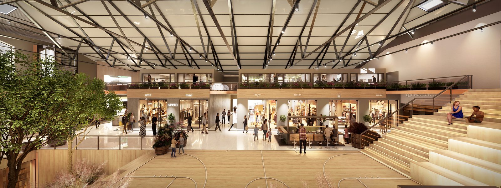 Plaza central con gradas, locales y entrepiso bajo la cubierta metálica